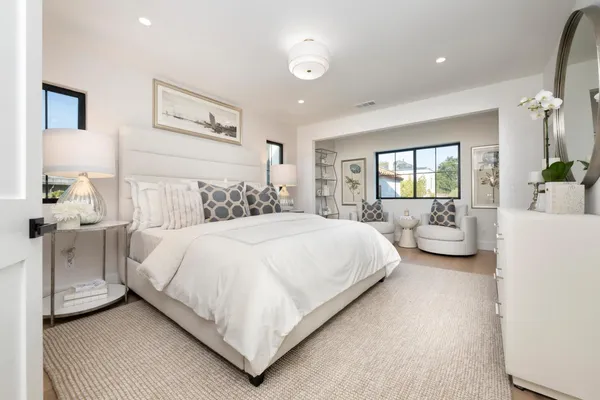 a bedroom with bed and a couch