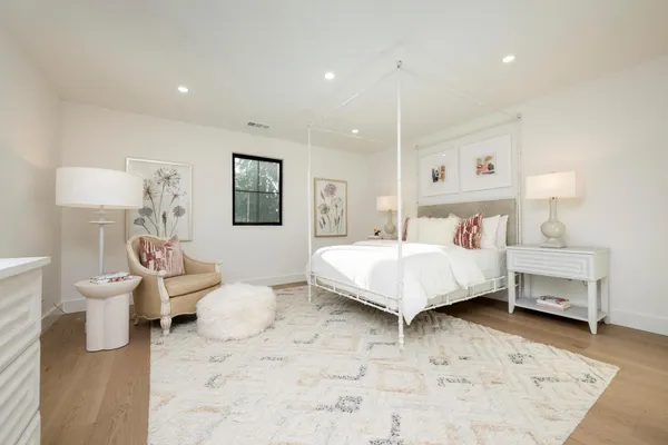 a bedroom with a bed and a couch
