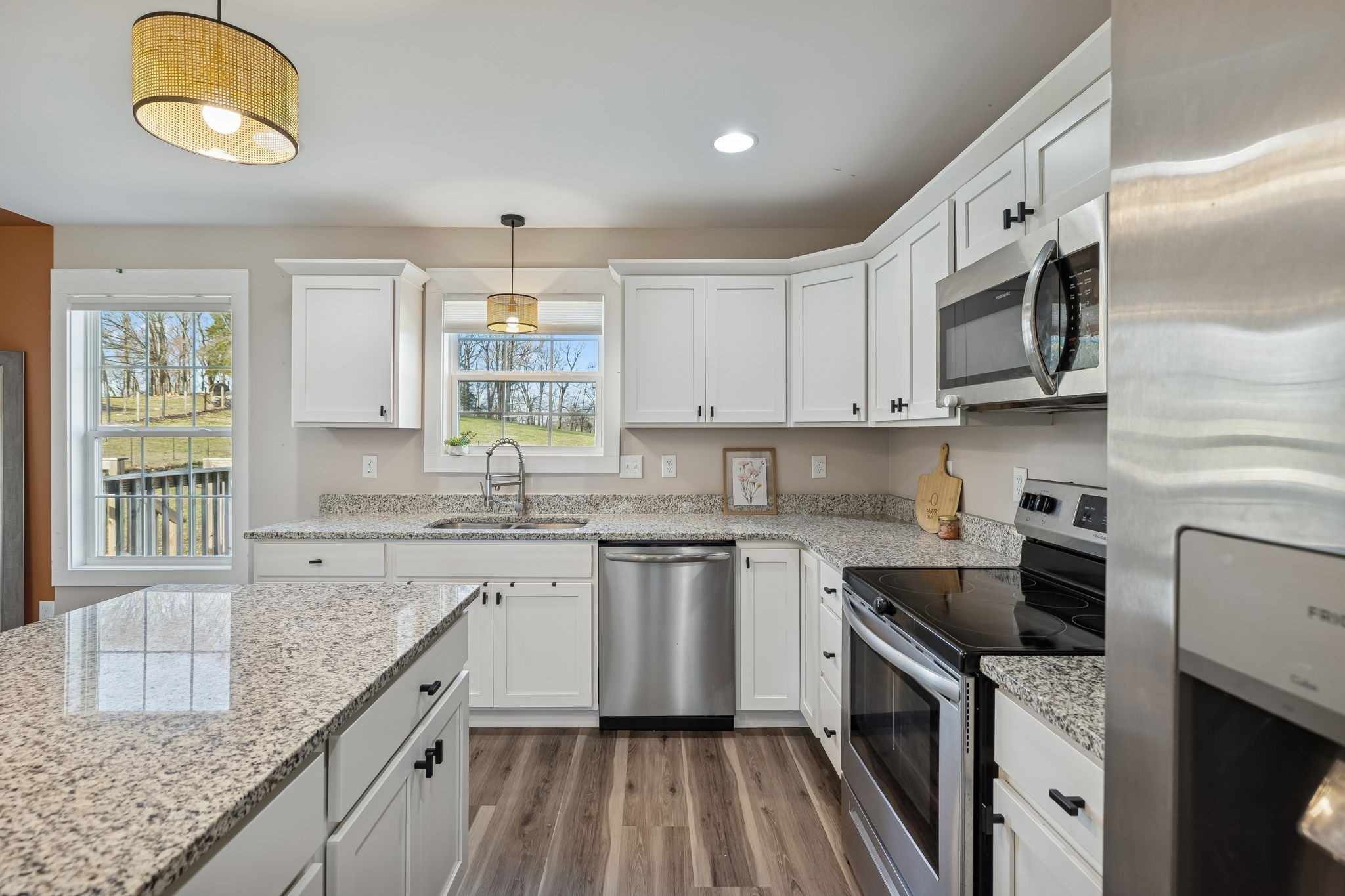 1521 Wixtown Road Westmoreland, TN 37186 - Photo 12 of 25 a kitchen with granite countertop cabinets stainless steel appliances and a sink