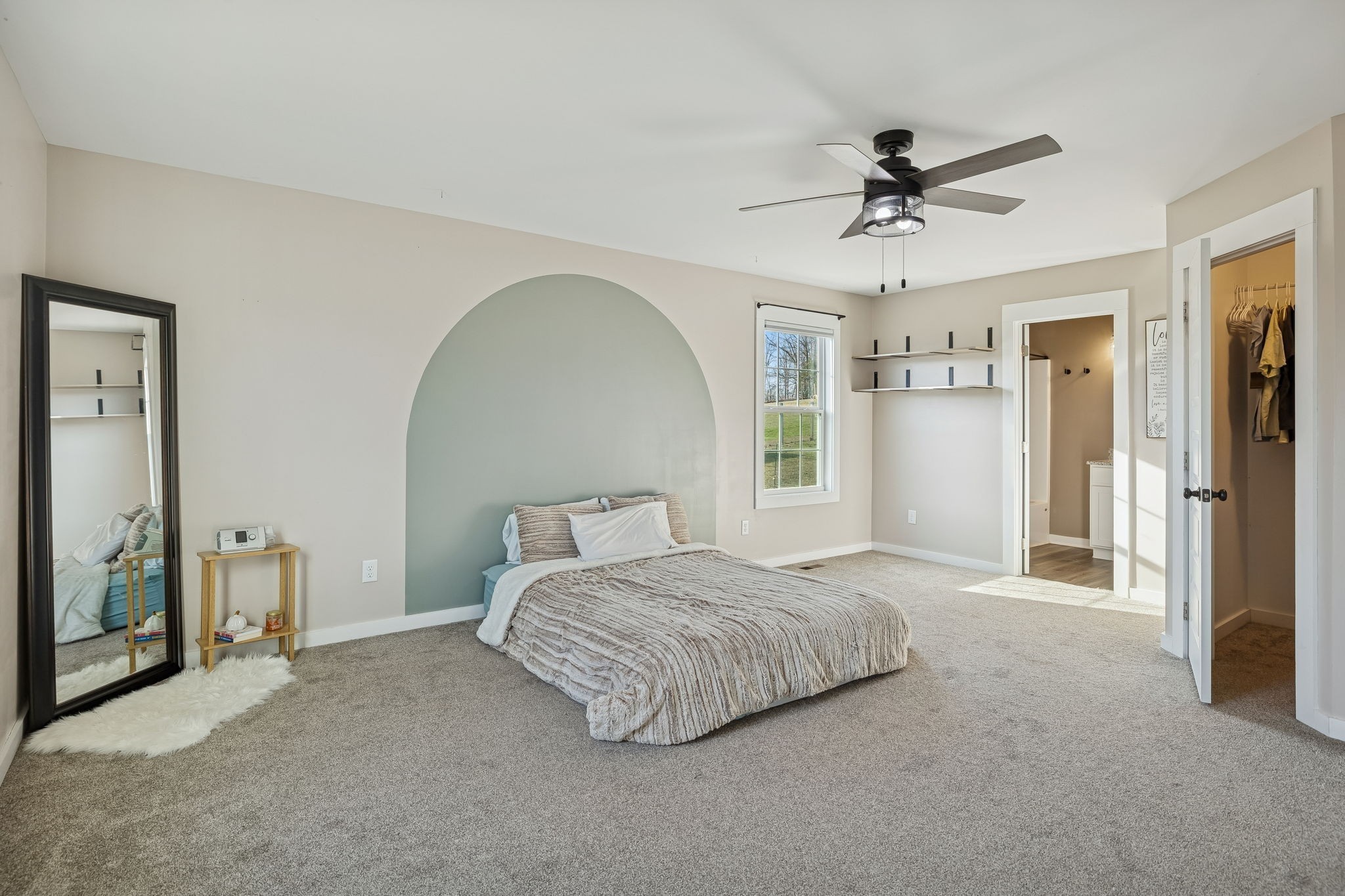 1521 Wixtown Road Westmoreland, TN 37186 - Photo 17 of 25 a bedroom with a bed and a chandelier