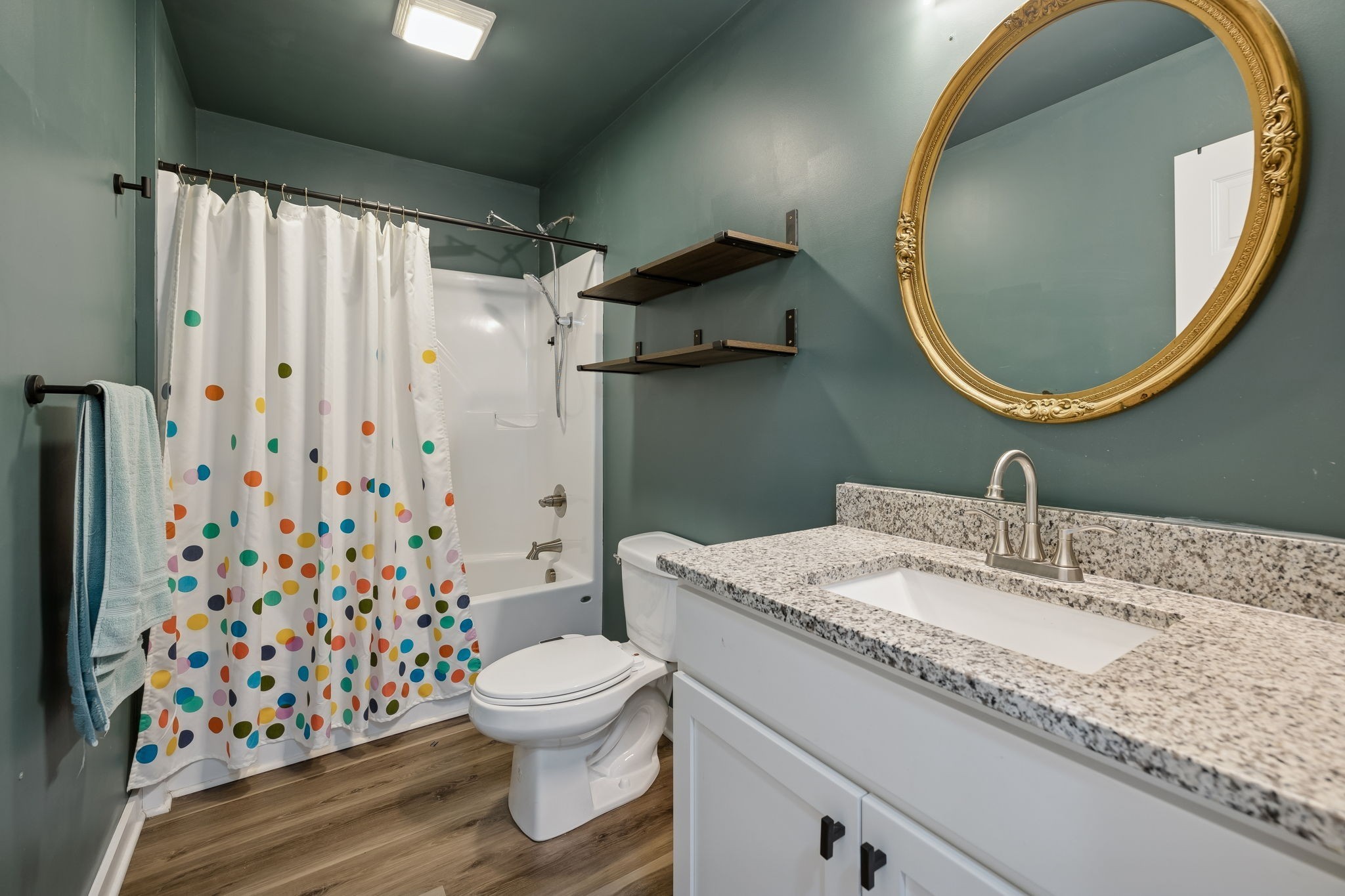 1521 Wixtown Road Westmoreland, TN 37186 - Photo 20 of 25 a bathroom with a granite countertop toilet sink and mirror