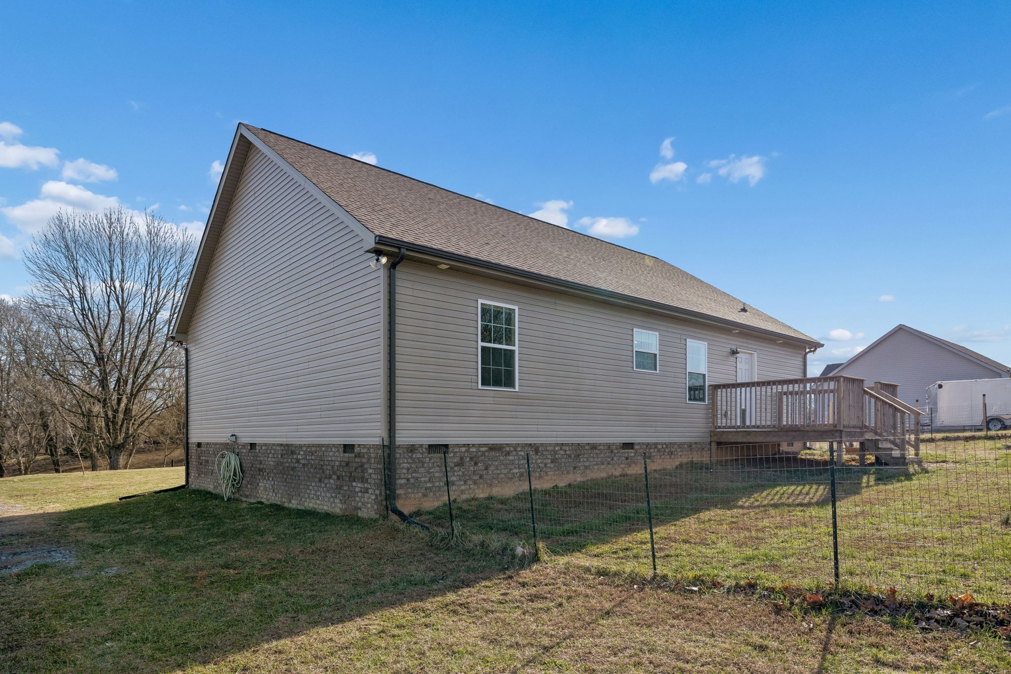 1521 Wixtown Road Westmoreland, TN 37186 - Photo 22 of 25 a view of a house with a backyard