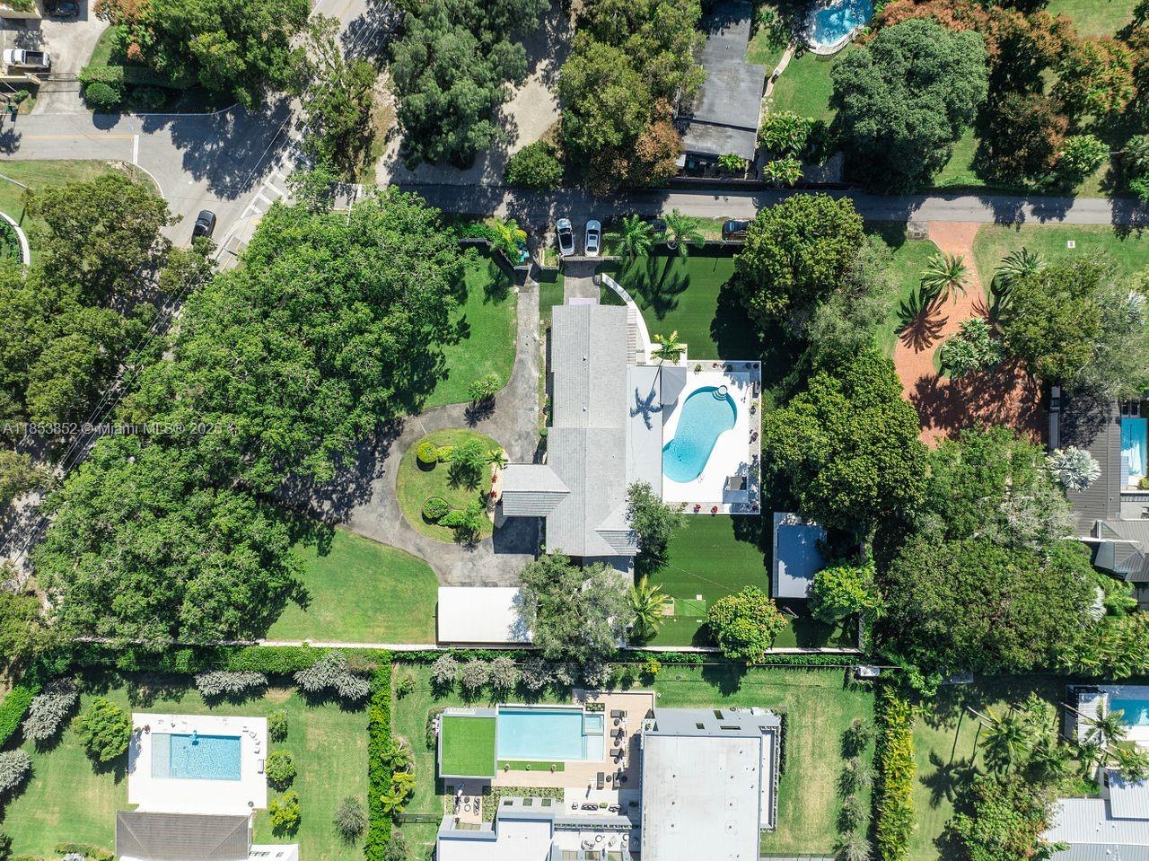 13000 Old Cutler Road Pinecrest, FL 33156 - Photo 39 of 43 an aerial view of a house with a yard and garden