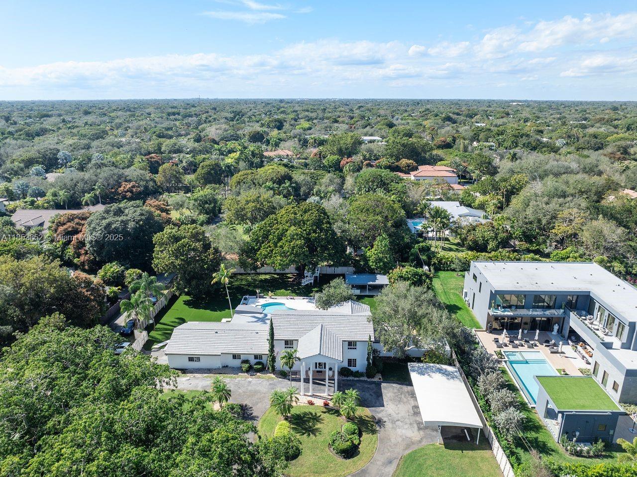 13000 Old Cutler Road Pinecrest, FL 33156 - Photo 40 of 43 an aerial view of a house with a garden