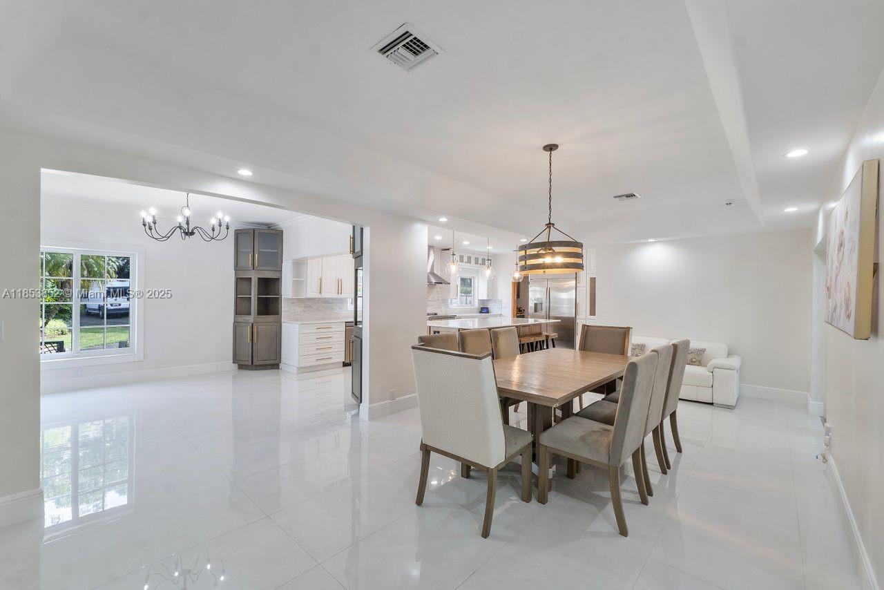 13000 Old Cutler Road Pinecrest, FL 33156 - Photo 4 of 43 a view of a dining room with furniture