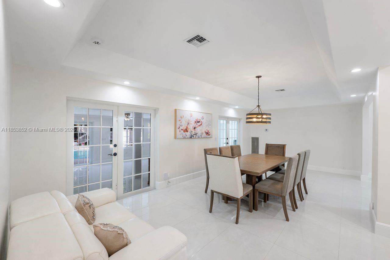 13000 Old Cutler Road Pinecrest, FL 33156 - Photo 8 of 43 a view of a dining room with furniture