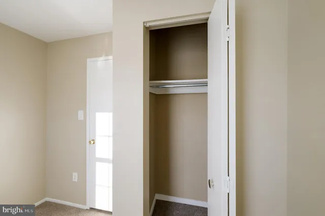 a view of a hallway with a white walls