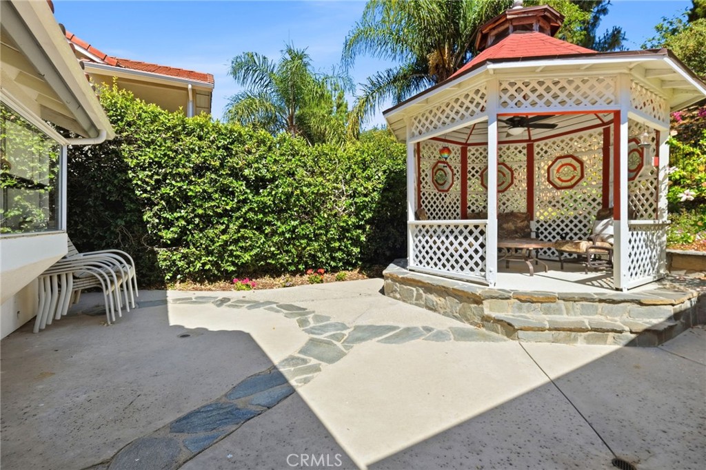 18233 Charlton Lane Porter Ranch, CA 91326 - Photo 24 of 40 a front view of a house with garden