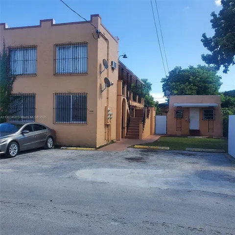 a car parked in front of a house