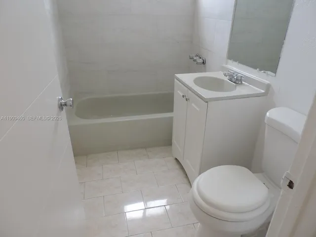 a bathroom with a sink a toilet and a bathtub