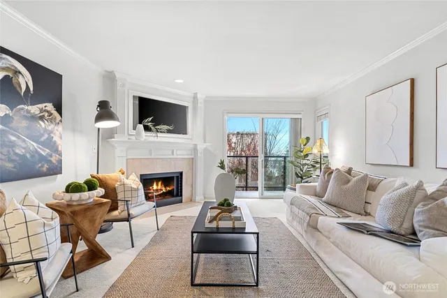 a living room with furniture a flat screen tv and a fireplace
