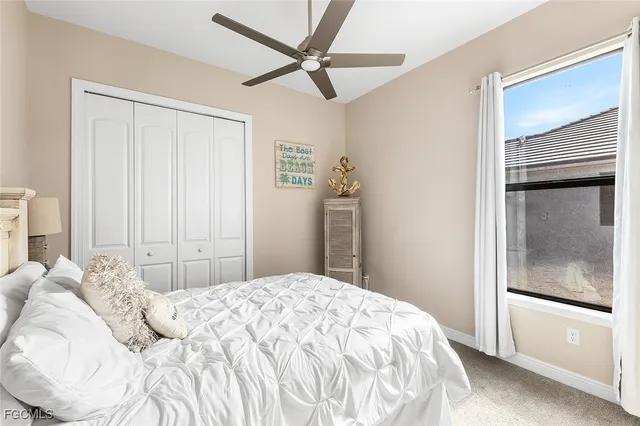 a spacious bathroom with a granite countertop sink and a mirror