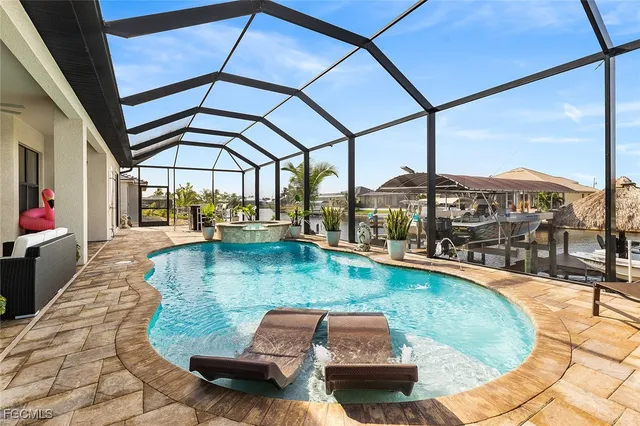 a view of a swimming pool with a patio