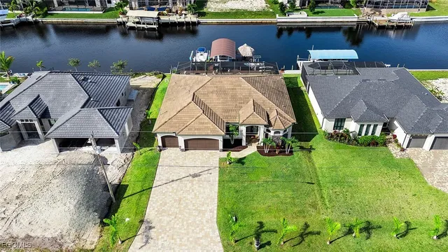 an aerial view of multiple house with yard swimming pool and outdoor seating