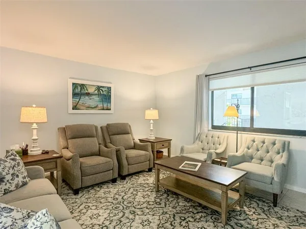a view of a dining room with furniture window and outside view