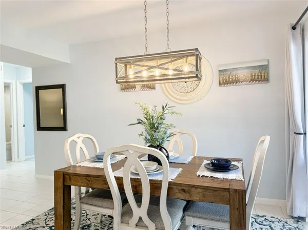 a kitchen with stainless steel appliances kitchen island a white cabinets and sink