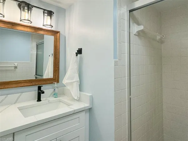 a bathroom with a sink and a mirror
