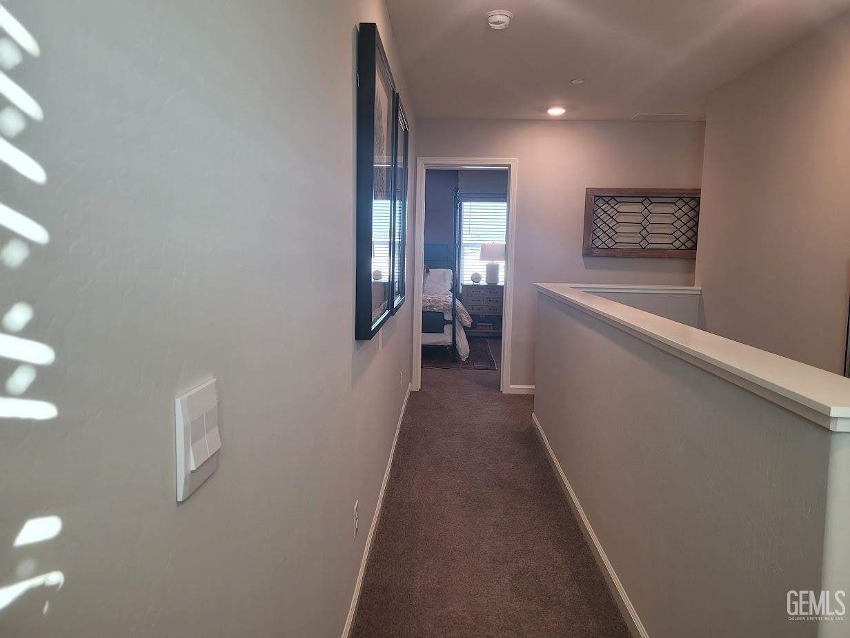 Undisclosed Address Bakersfield, CA 93313 - Photo 12 of 25 a view of a hallway with a couch