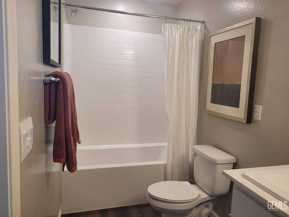 Undisclosed Address Bakersfield, CA 93313 - Photo 16 of 25 a bathroom with a shower a toilet and a sink