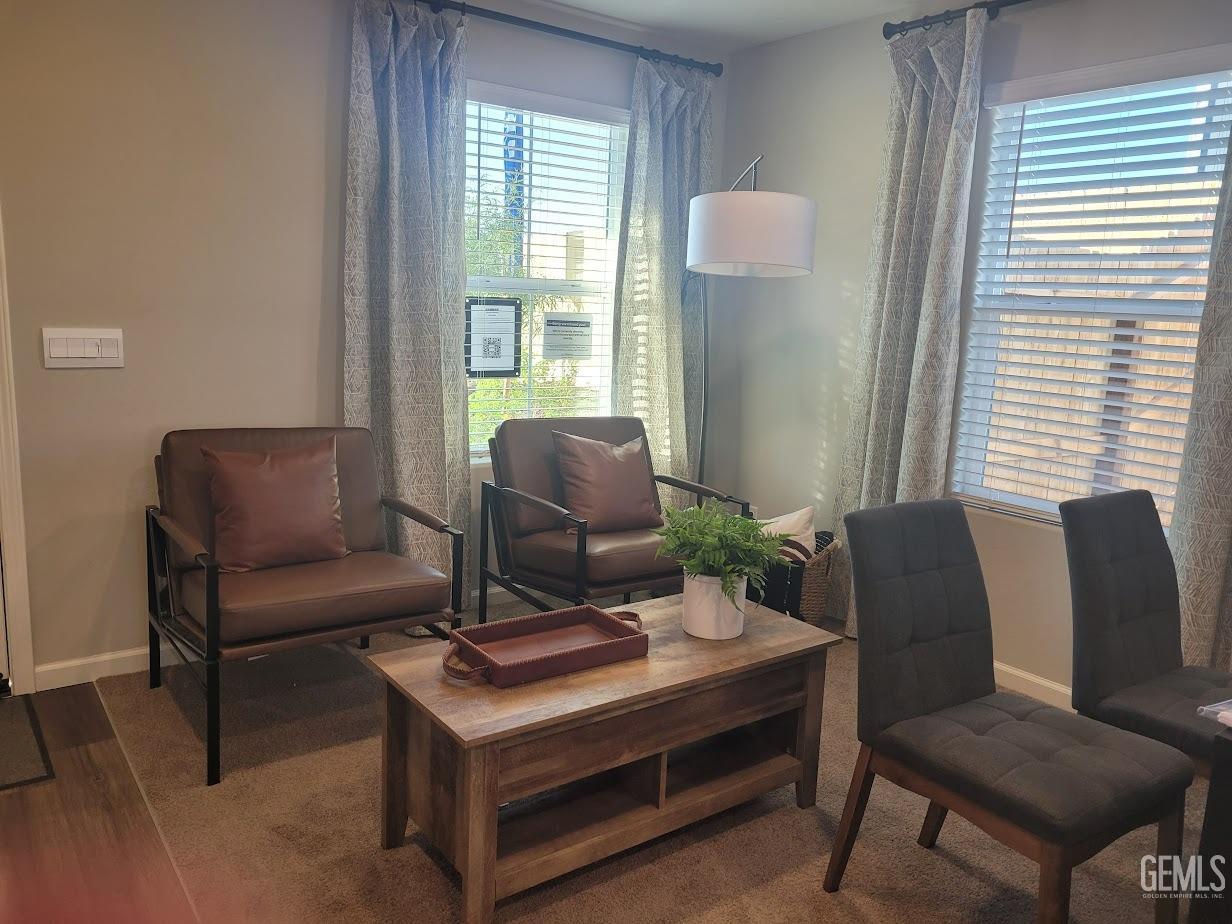 Undisclosed Address Bakersfield, CA 93313 - Photo 2 of 25 a living room with furniture and a window