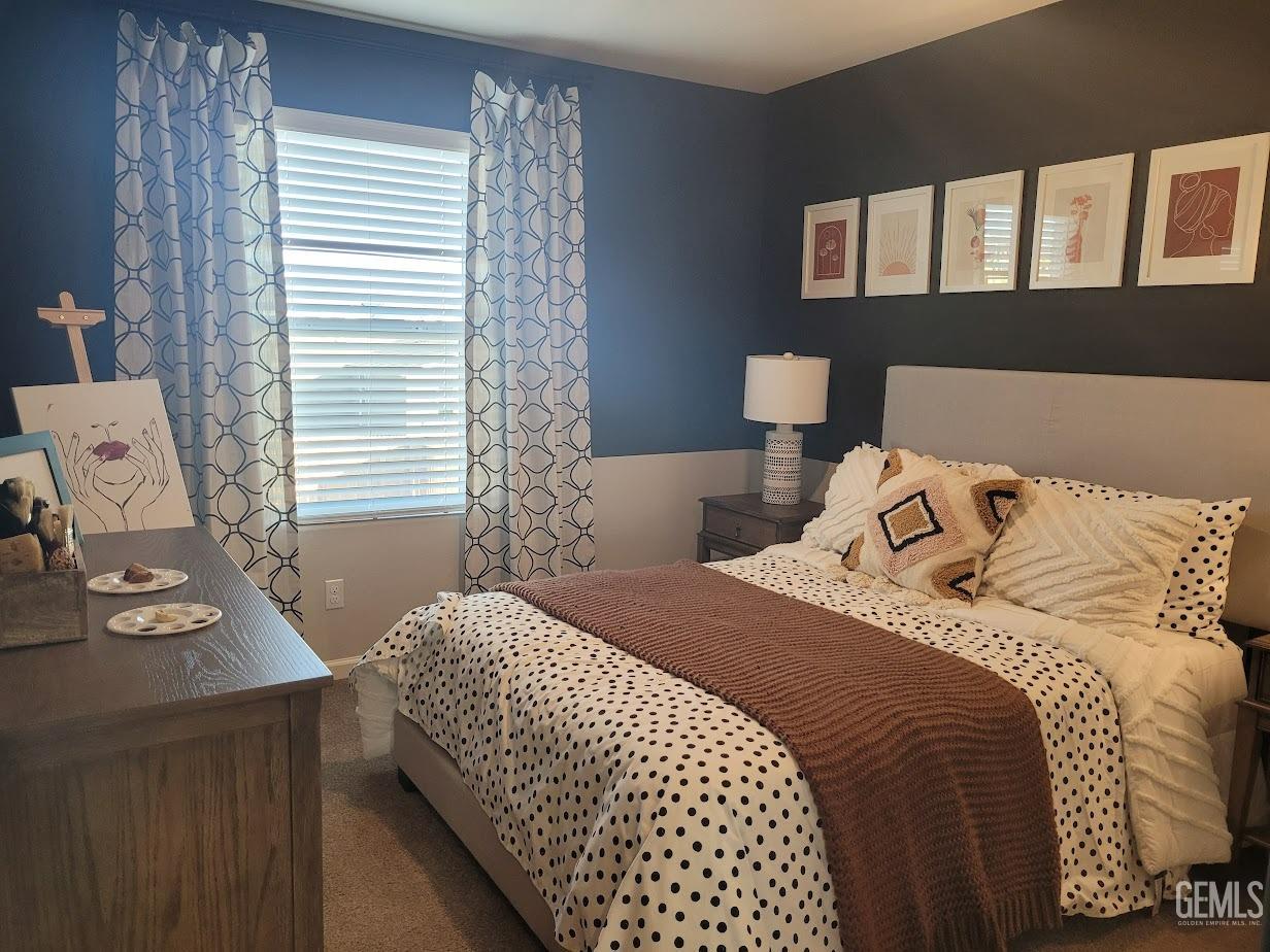 Undisclosed Address Bakersfield, CA 93313 - Photo 21 of 25 a bedroom with a bed and a window