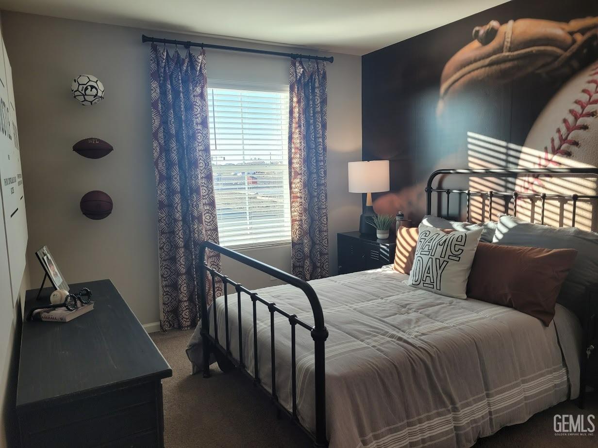 Undisclosed Address Bakersfield, CA 93313 - Photo 24 of 25 a bedroom with a bed and a window