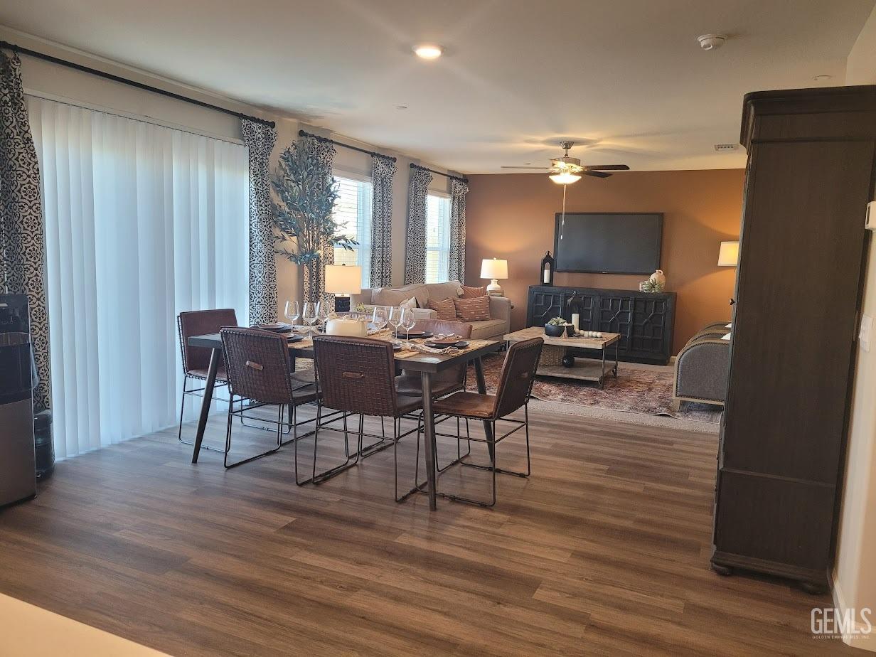 Undisclosed Address Bakersfield, CA 93313 - Photo 4 of 25 a view of a dining room with furniture window and wooden floor
