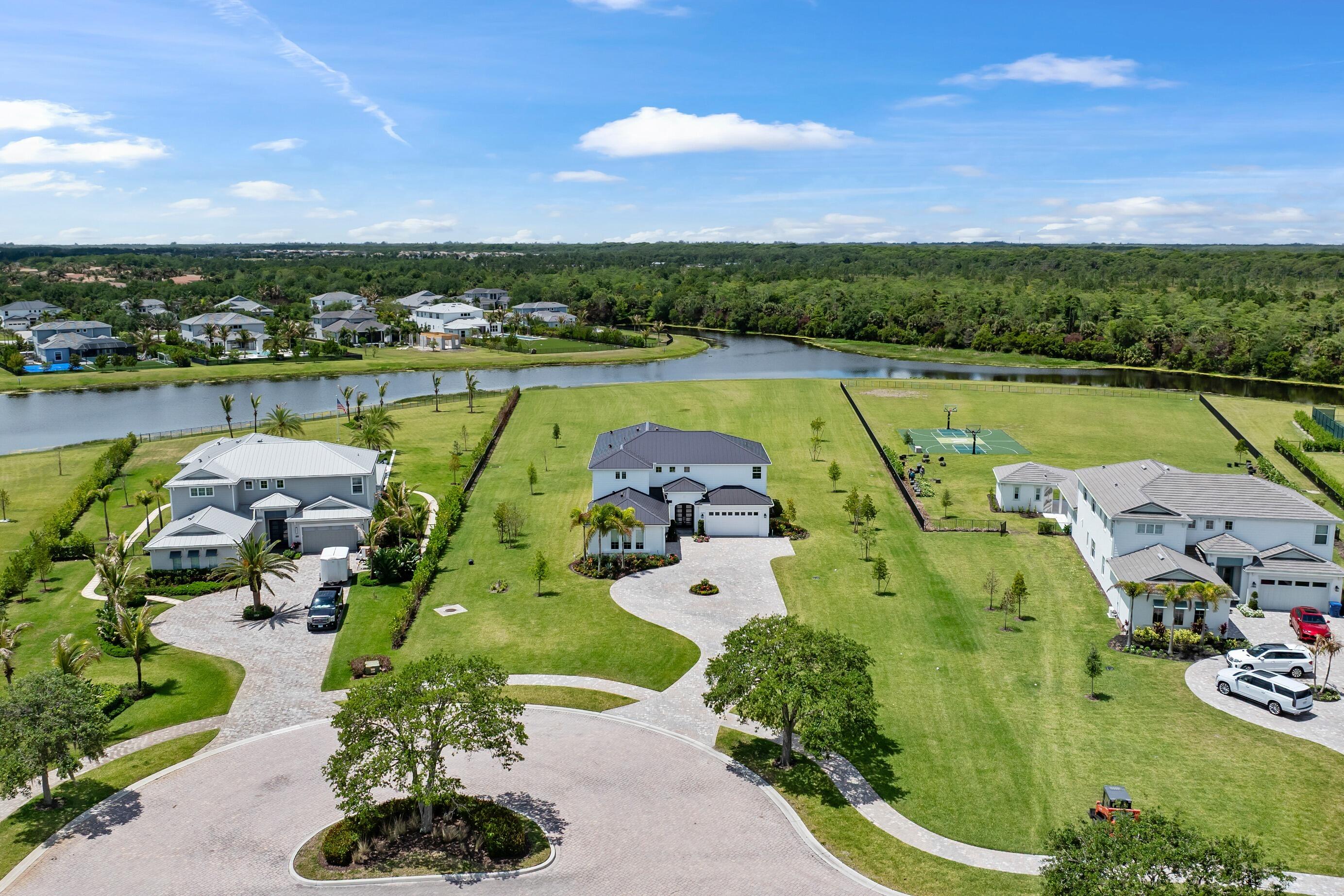20060 Southeast Bridgewater Drive Jupiter, FL 33458 - Photo 1 of 68 an aerial view of a swimming pool with a yard