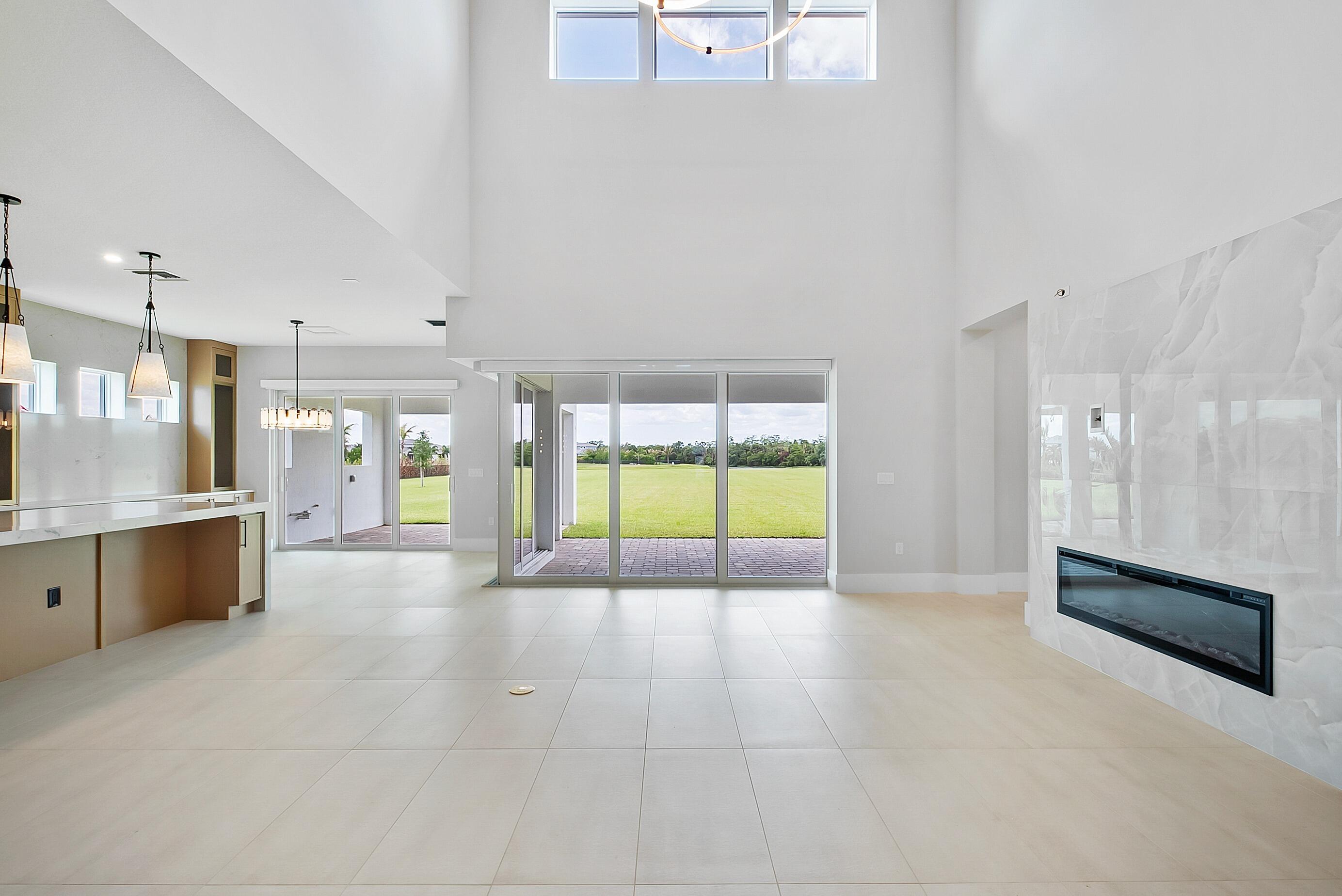 20060 Southeast Bridgewater Drive Jupiter, FL 33458 - Photo 17 of 68 a large white kitchen with a large window and a counter top space