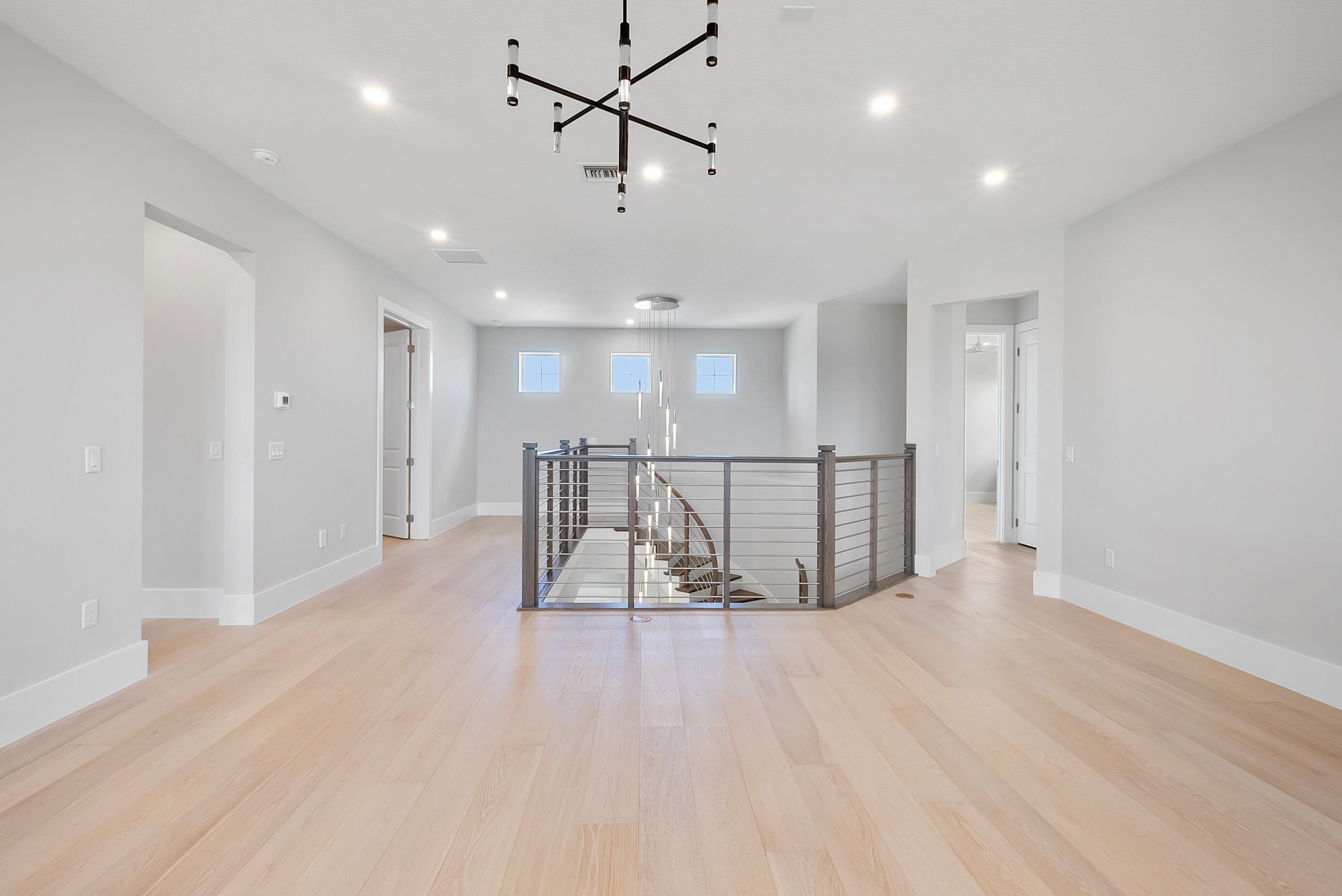 20060 Southeast Bridgewater Drive Jupiter, FL 33458 - Photo 32 of 68 a view of a room with wooden floor and windows
