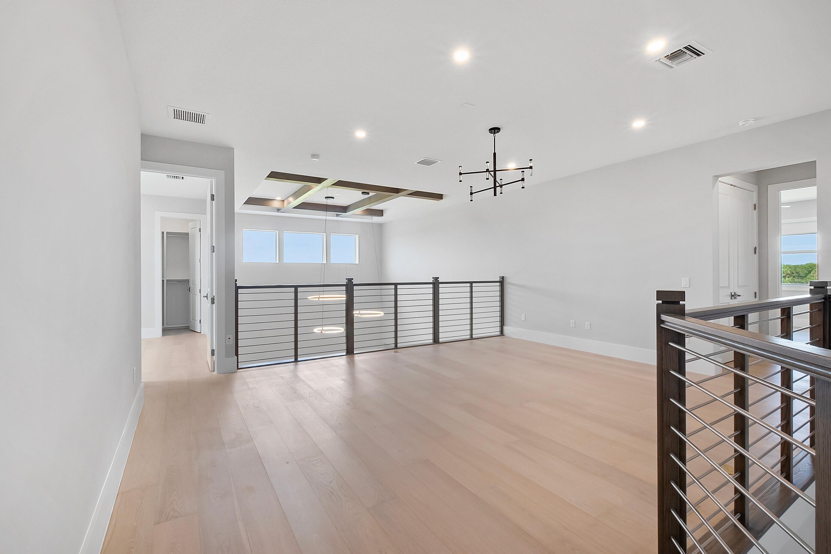 20060 Southeast Bridgewater Drive Jupiter, FL 33458 - Photo 33 of 68 an empty room with wooden floor and windows
