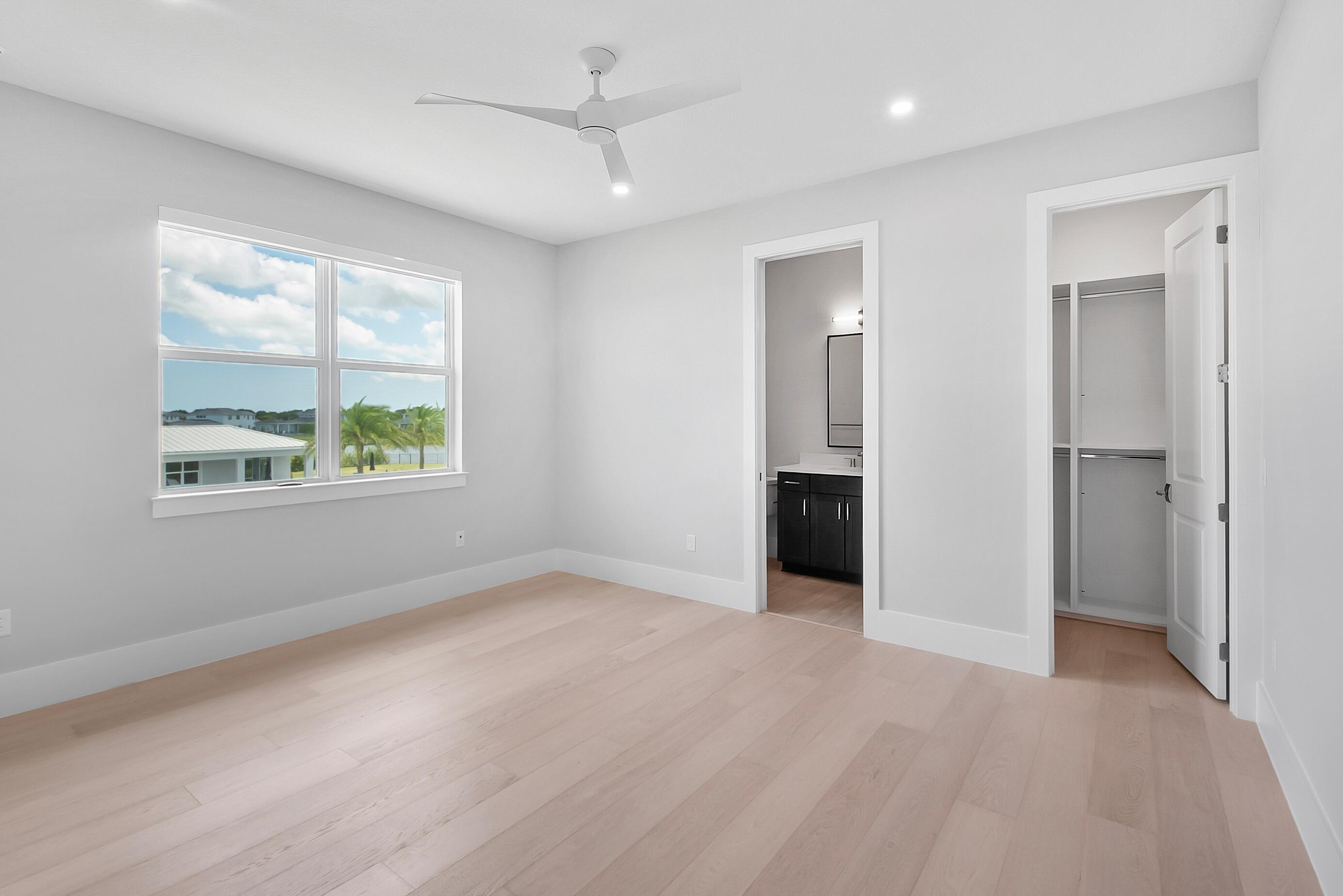 20060 Southeast Bridgewater Drive Jupiter, FL 33458 - Photo 41 of 68 wooden floor in an empty room with a window