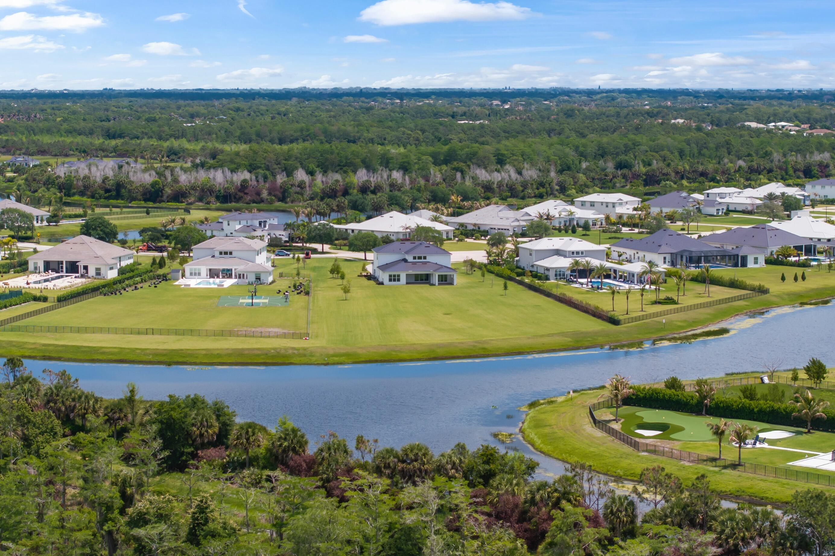 20060 Southeast Bridgewater Drive Jupiter, FL 33458 - Photo 45 of 68 an aerial view of a house with a garden and lake view