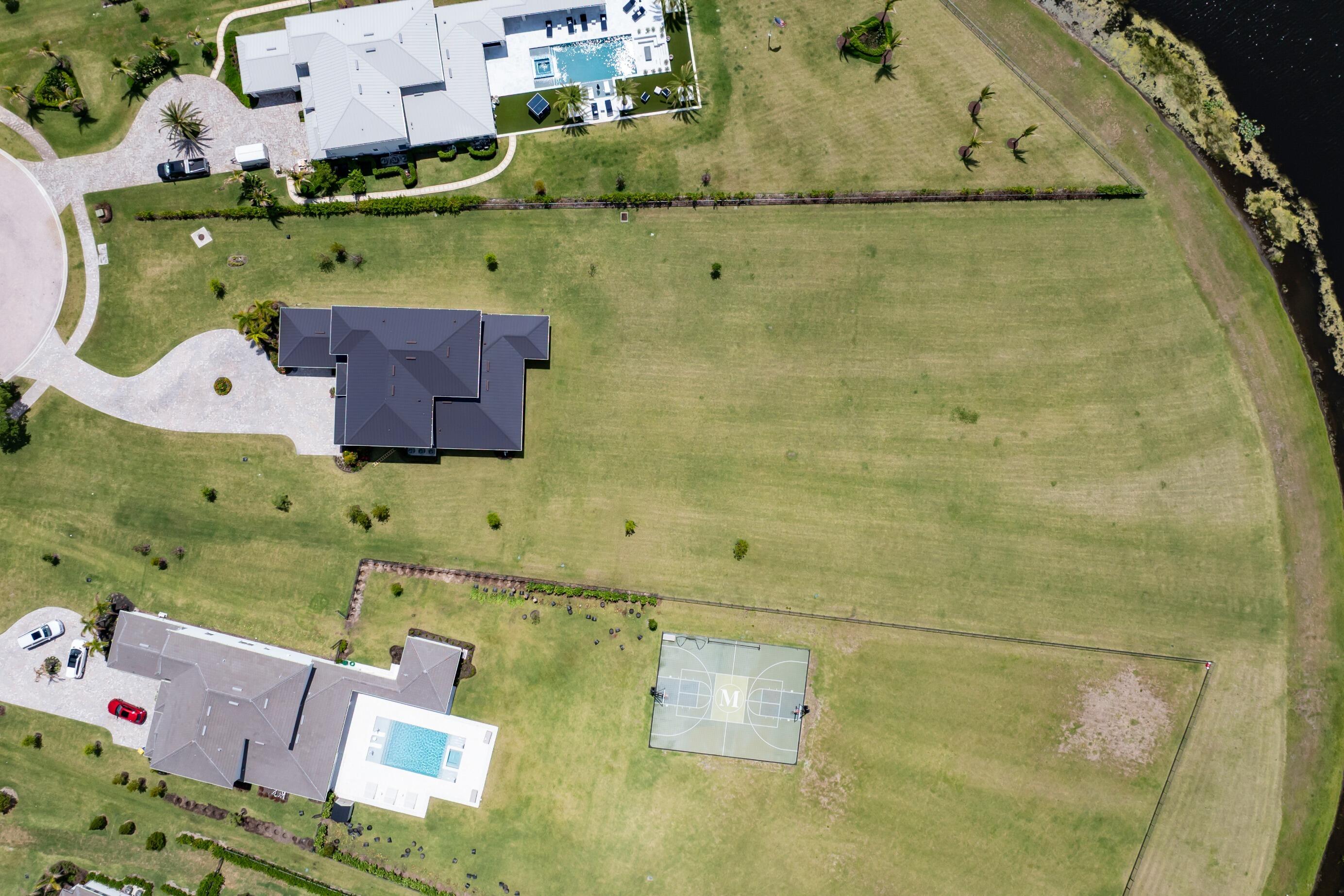 20060 Southeast Bridgewater Drive Jupiter, FL 33458 - Photo 46 of 68 an aerial view of a house with a swimming pool