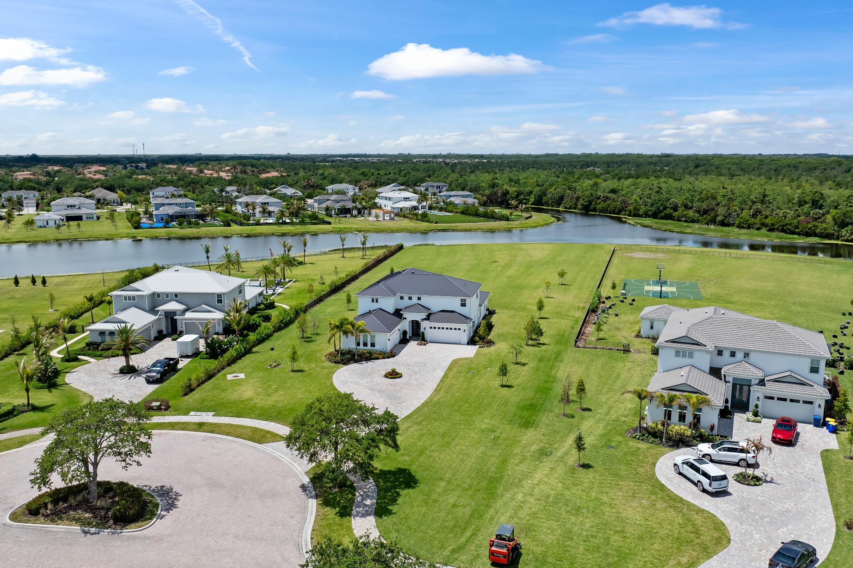 20060 Southeast Bridgewater Drive Jupiter, FL 33458 - Photo 47 of 68 an aerial view of a house with a swimming pool and outdoor seating