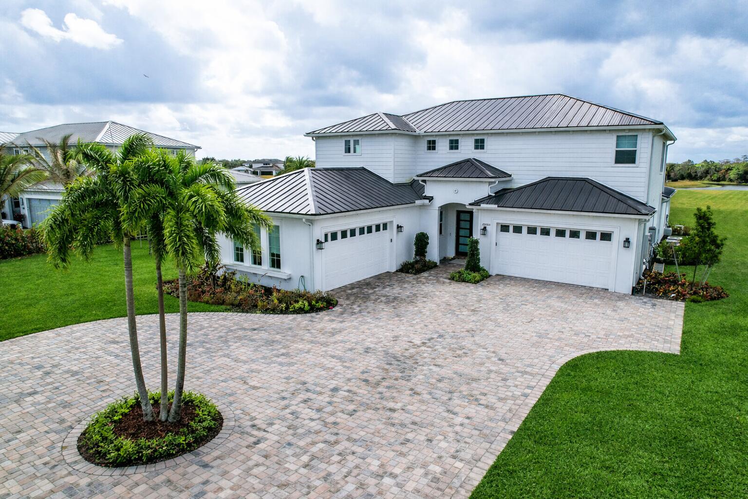 20060 Southeast Bridgewater Drive Jupiter, FL 33458 - Photo 48 of 68 a front view of a house with a yard