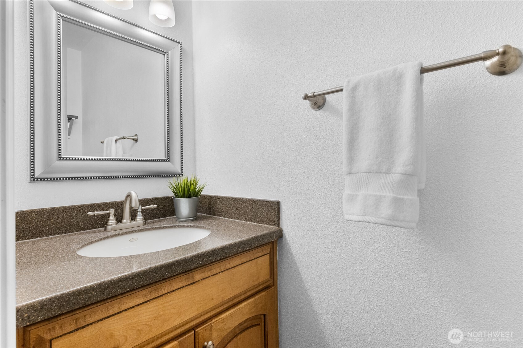 1555 Union Avenue Northeast, Unit 39 Renton, WA 98059 - Photo 12 of 19 a bathroom with a granite countertop sink and a mirror