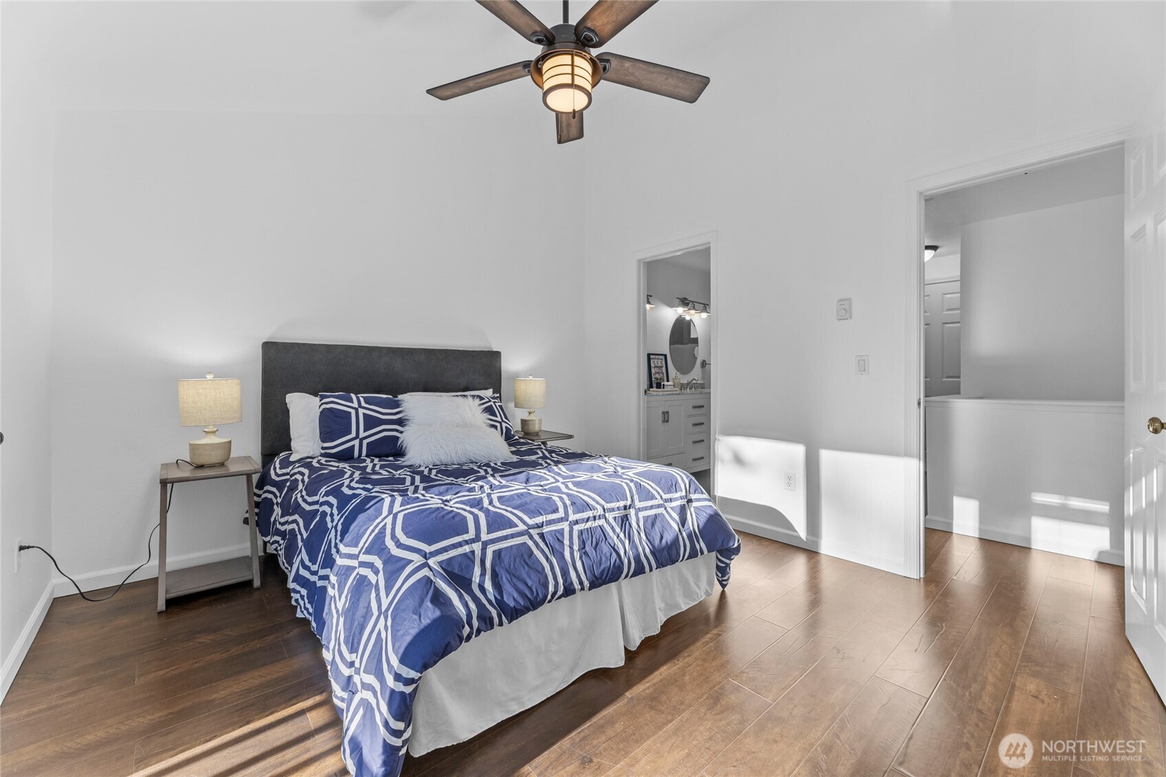 1555 Union Avenue Northeast, Unit 39 Renton, WA 98059 - Photo 14 of 19 a bedroom with a bed and wooden floor