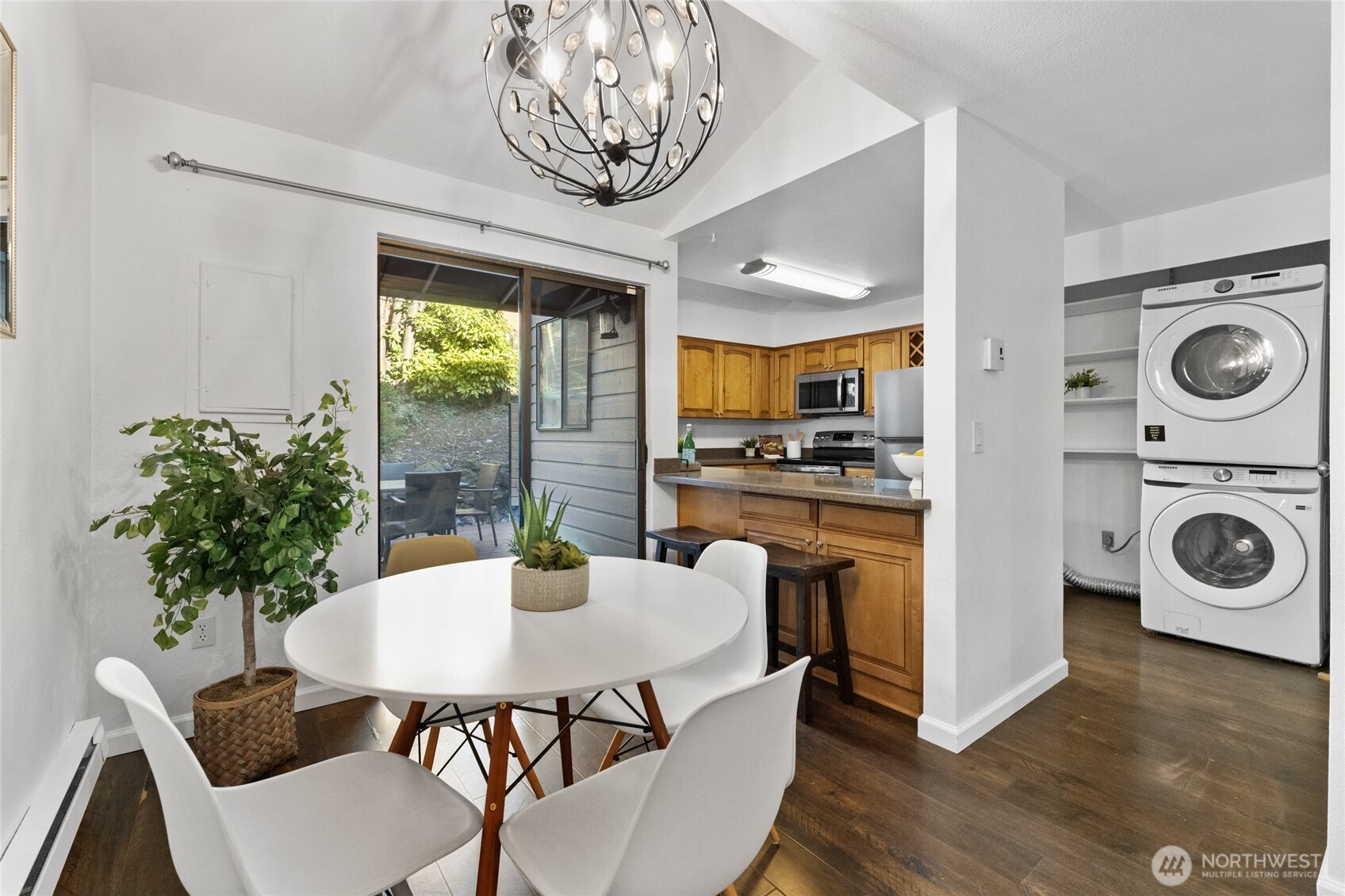 1555 Union Avenue Northeast, Unit 39 Renton, WA 98059 - Photo 5 of 19 a view of a dining room with furniture window and wooden floor