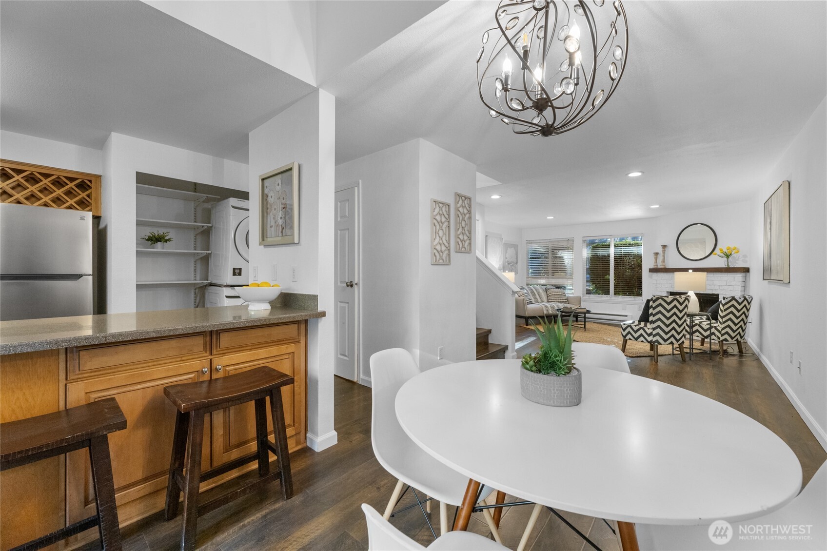 1555 Union Avenue Northeast, Unit 39 Renton, WA 98059 - Photo 6 of 19 a view of kitchen island with stainless steel appliances dining table and chairs