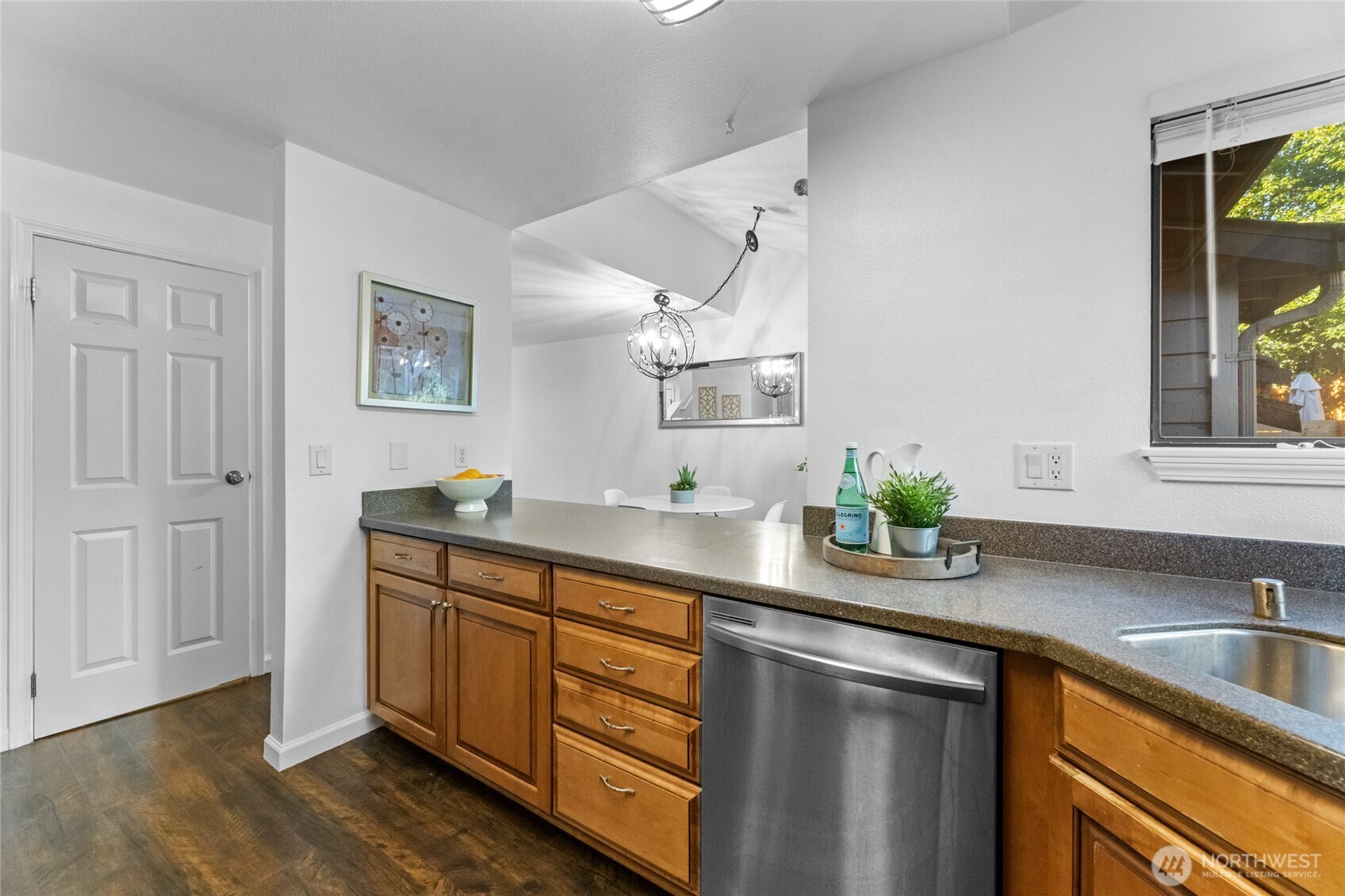 1555 Union Avenue Northeast, Unit 39 Renton, WA 98059 - Photo 8 of 19 a kitchen with stainless steel appliances a sink stove and cabinets