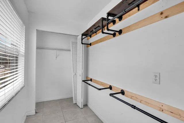 a view of a room with rack on the wall