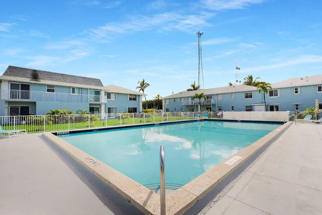 a view of a swimming pool with an outdoor seating