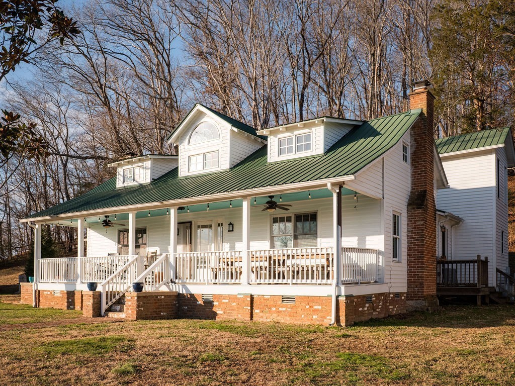 6415 Pinewood Road Nunnelly, TN 37137 - Photo 33 of 94 a front view of a house with a yard