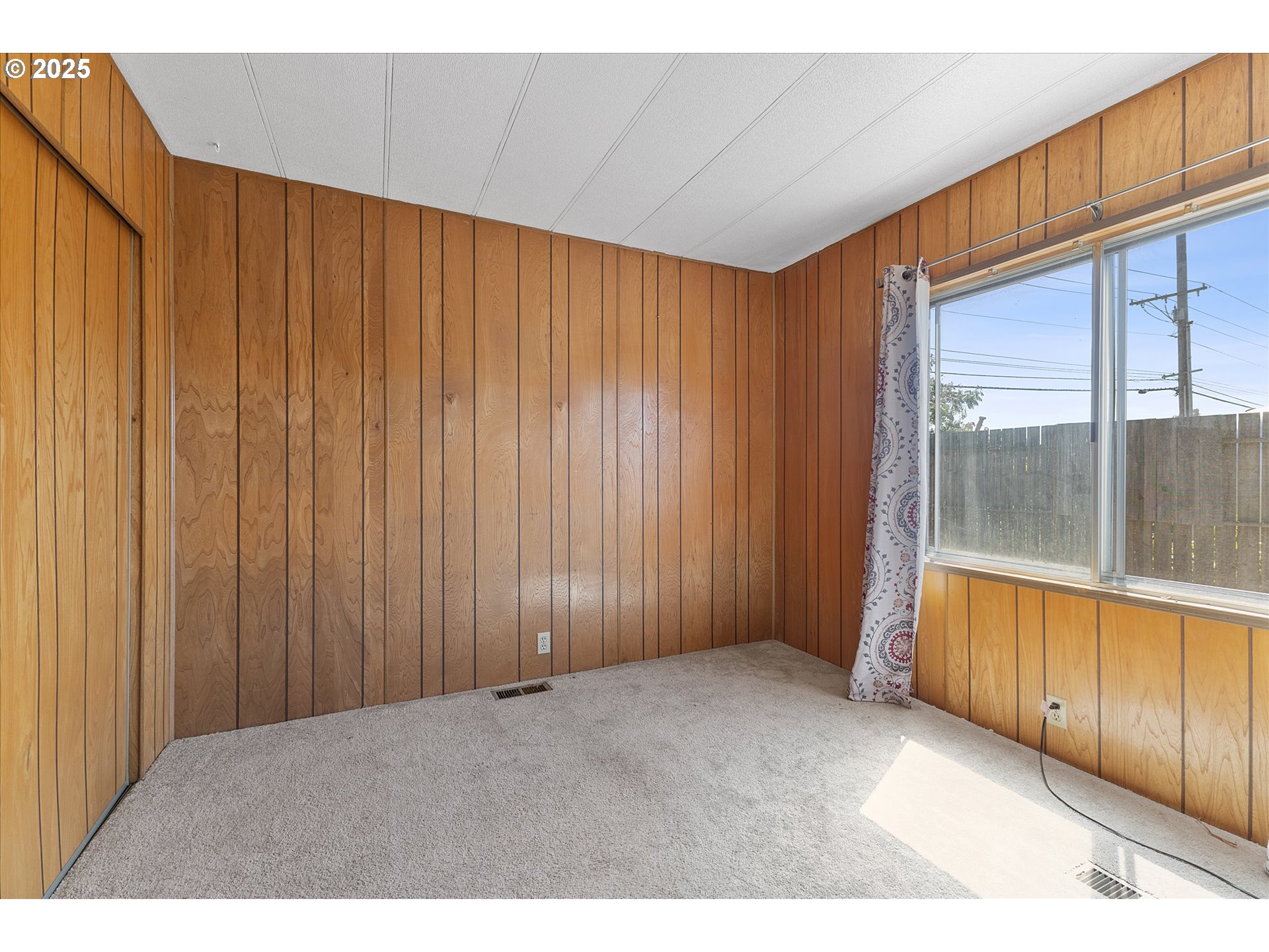 2902 East 2nd Street, Unit 110 Newberg, OR 97132 - Photo 19 of 29 a view of an empty room with a window