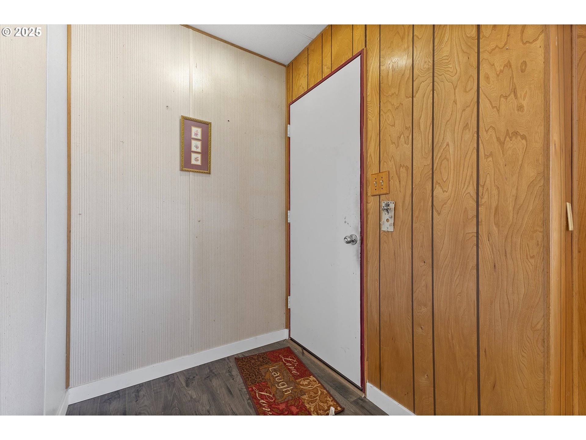 2902 East 2nd Street, Unit 110 Newberg, OR 97132 - Photo 2 of 29 a view of an entryway with wooden floor