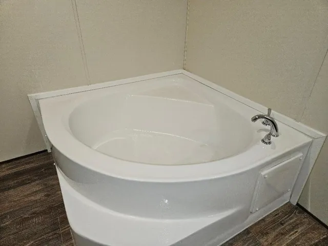 a white bath tub sitting in a bathroom