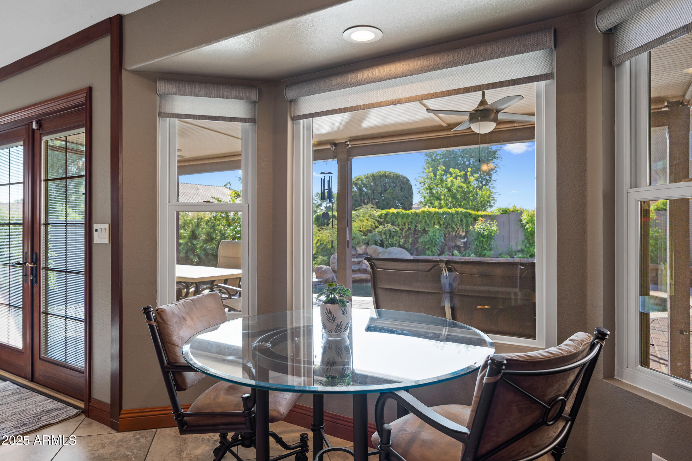 1111 West Lisa Lane Tempe, AZ 85284 - Photo 20 of 58 a dining room with furniture a chandelier and wooden floor