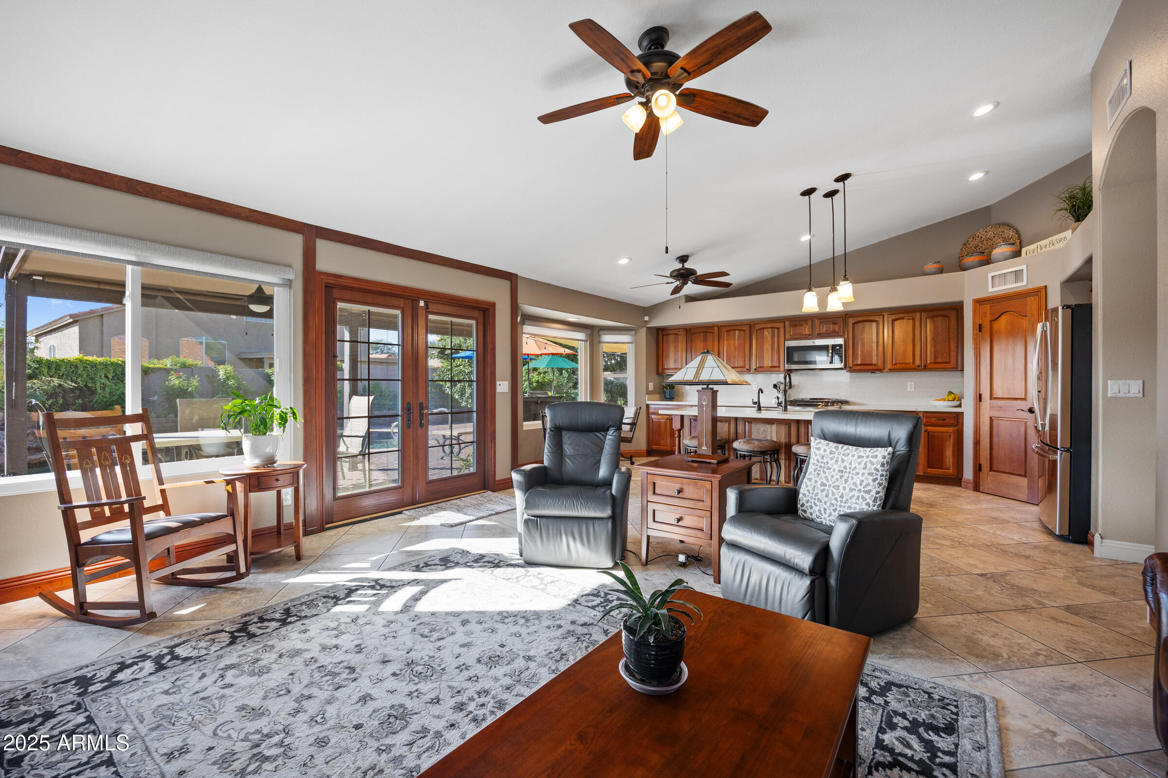 1111 West Lisa Lane Tempe, AZ 85284 - Photo 23 of 58 a living room with furniture kitchen view and a large window