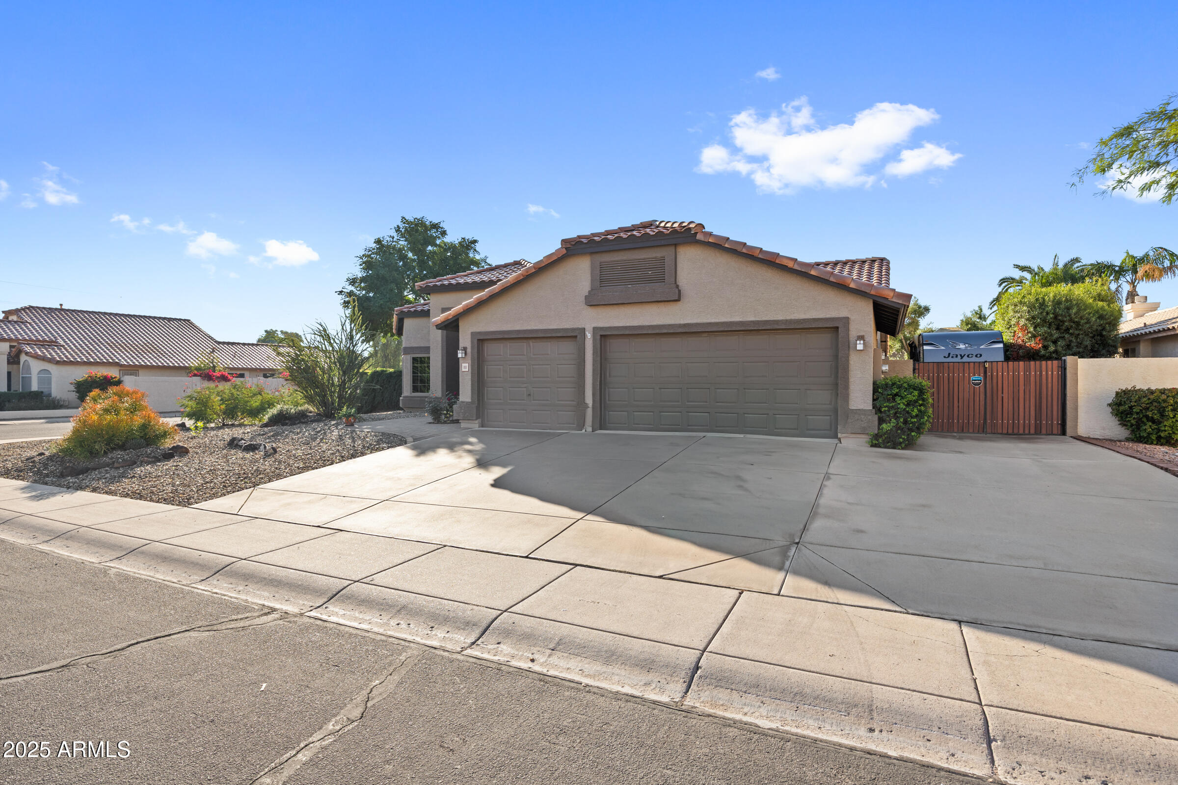 1111 West Lisa Lane Tempe, AZ 85284 - Photo 4 of 58 a front view of a house with a yard and garage